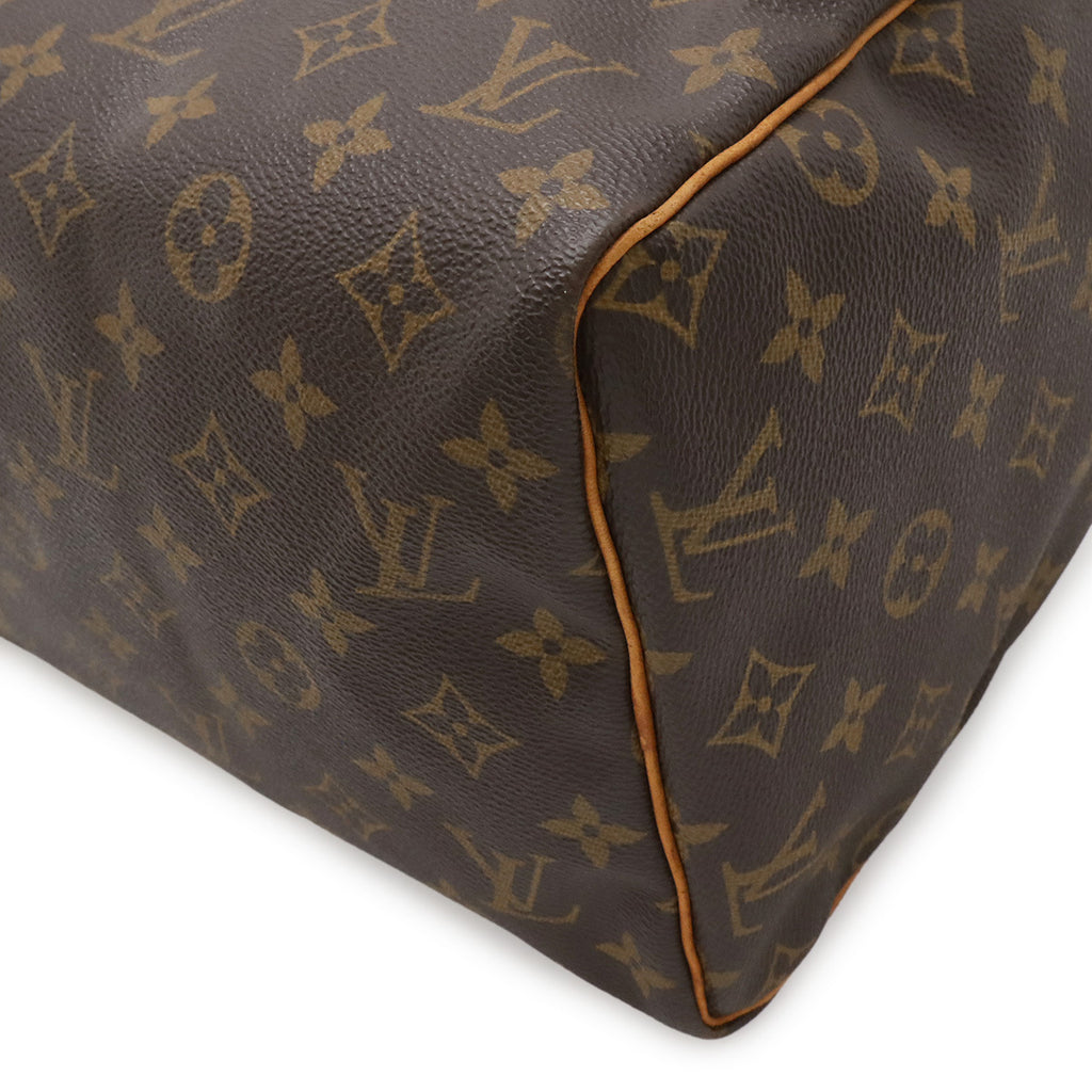 Louis Vuitton Speedy 30 nærbilde av håndtakene med dyp honningfarget patina
