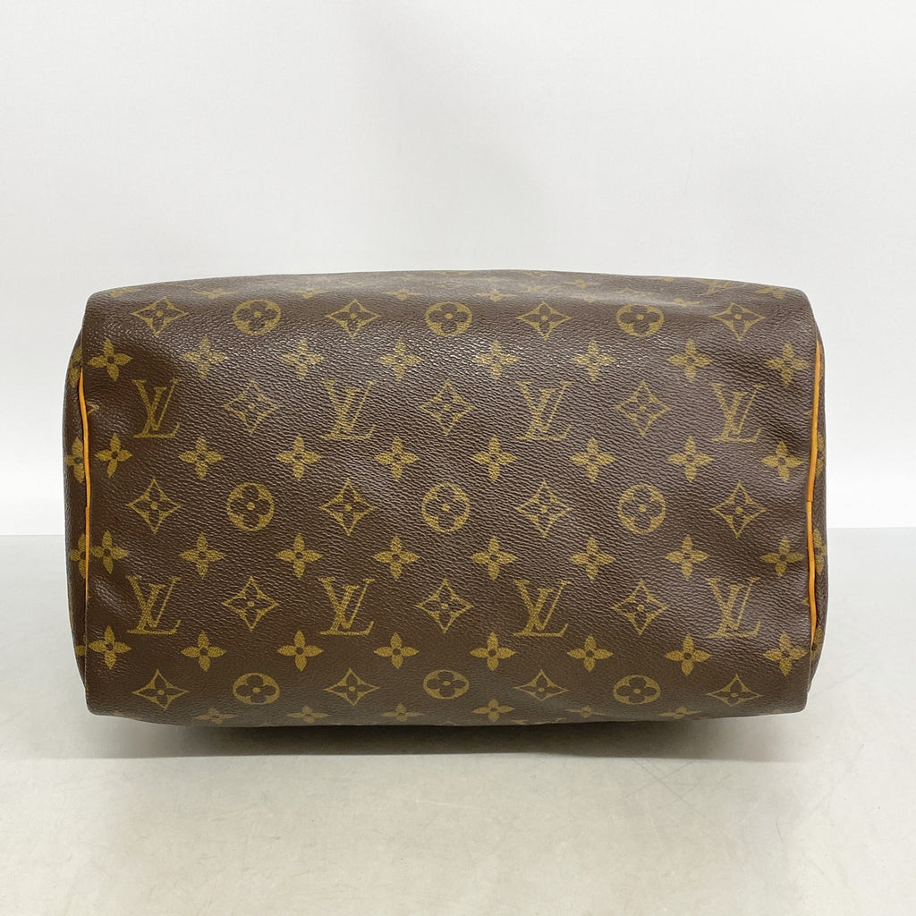 Louis Vuitton Speedy 30 innside med lyst fôr og innvendig åpen lomme