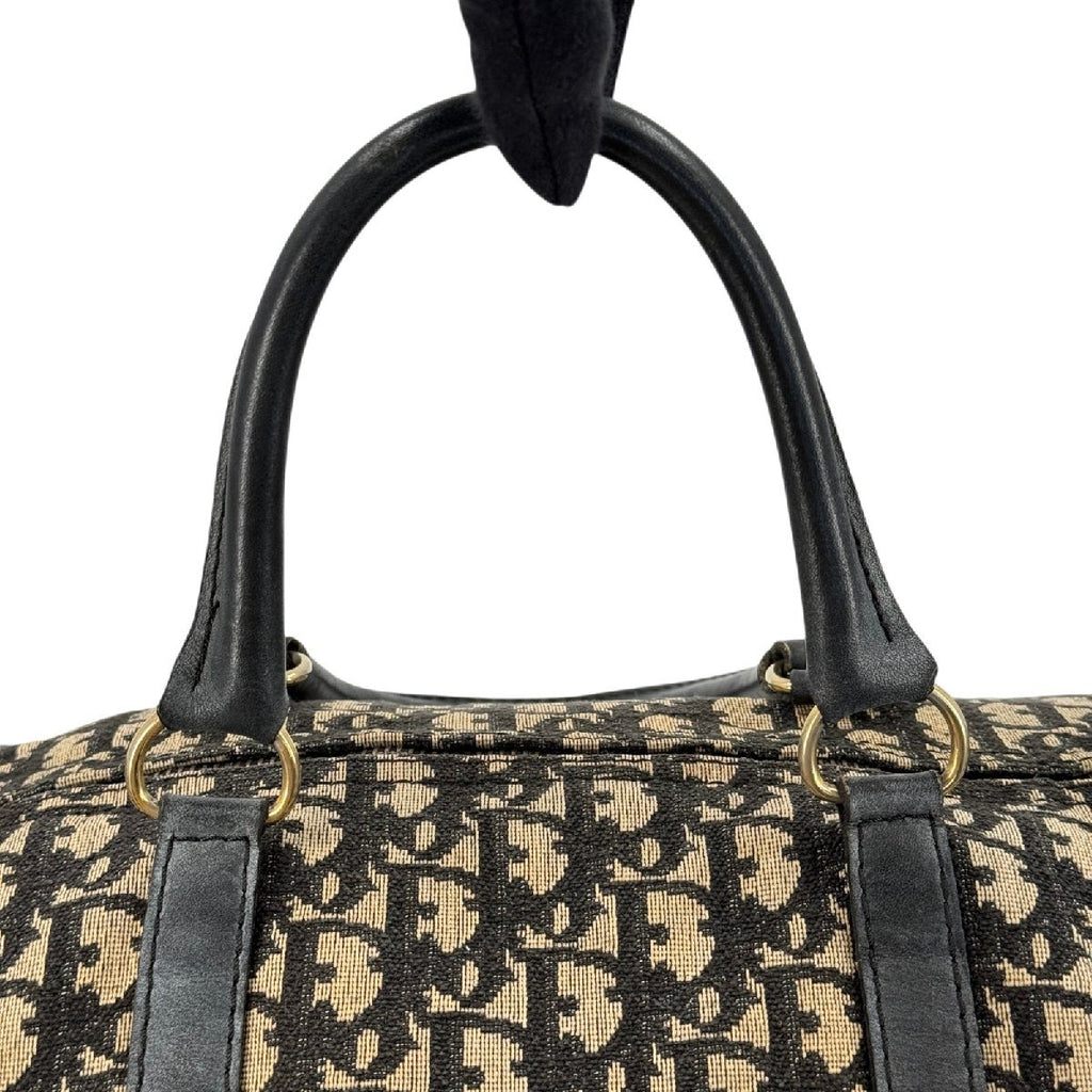 Dior Trotter Boston 40 innside med lyst fôr, glidelås i messing og innvendig lomme med flekker
