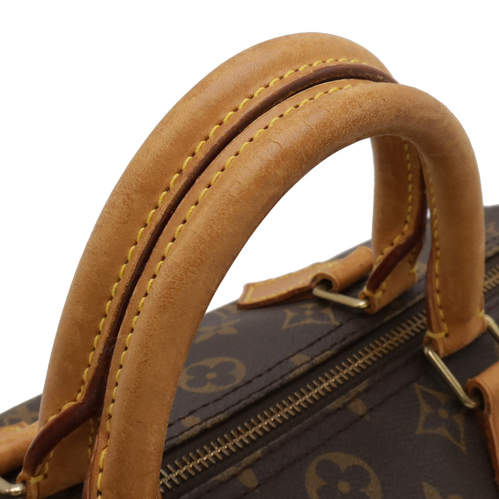 Louis Vuitton Speedy 30 nærbilde av glidelåstrekkeren og håndtaksfestet